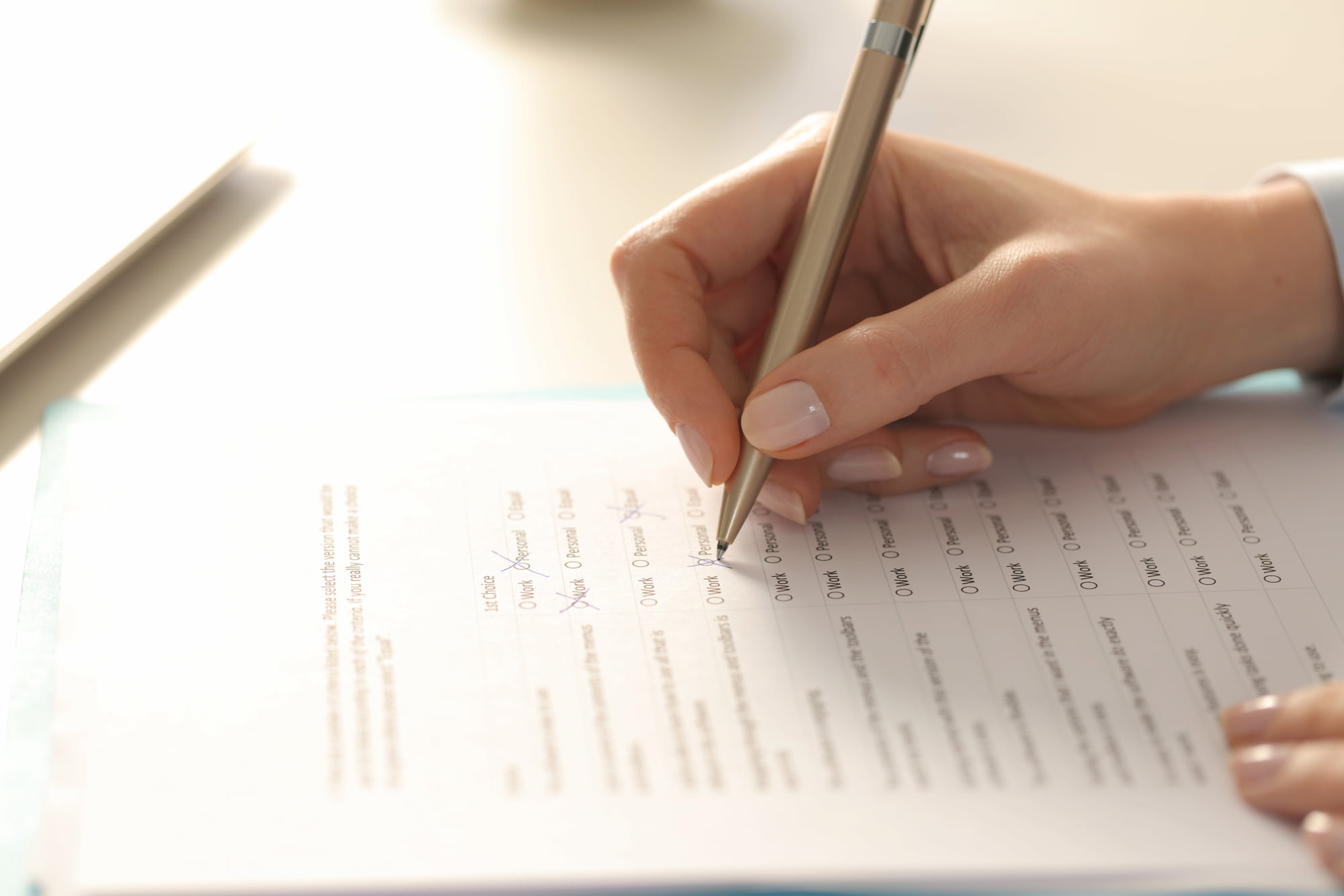 Hand filling in an insurance form