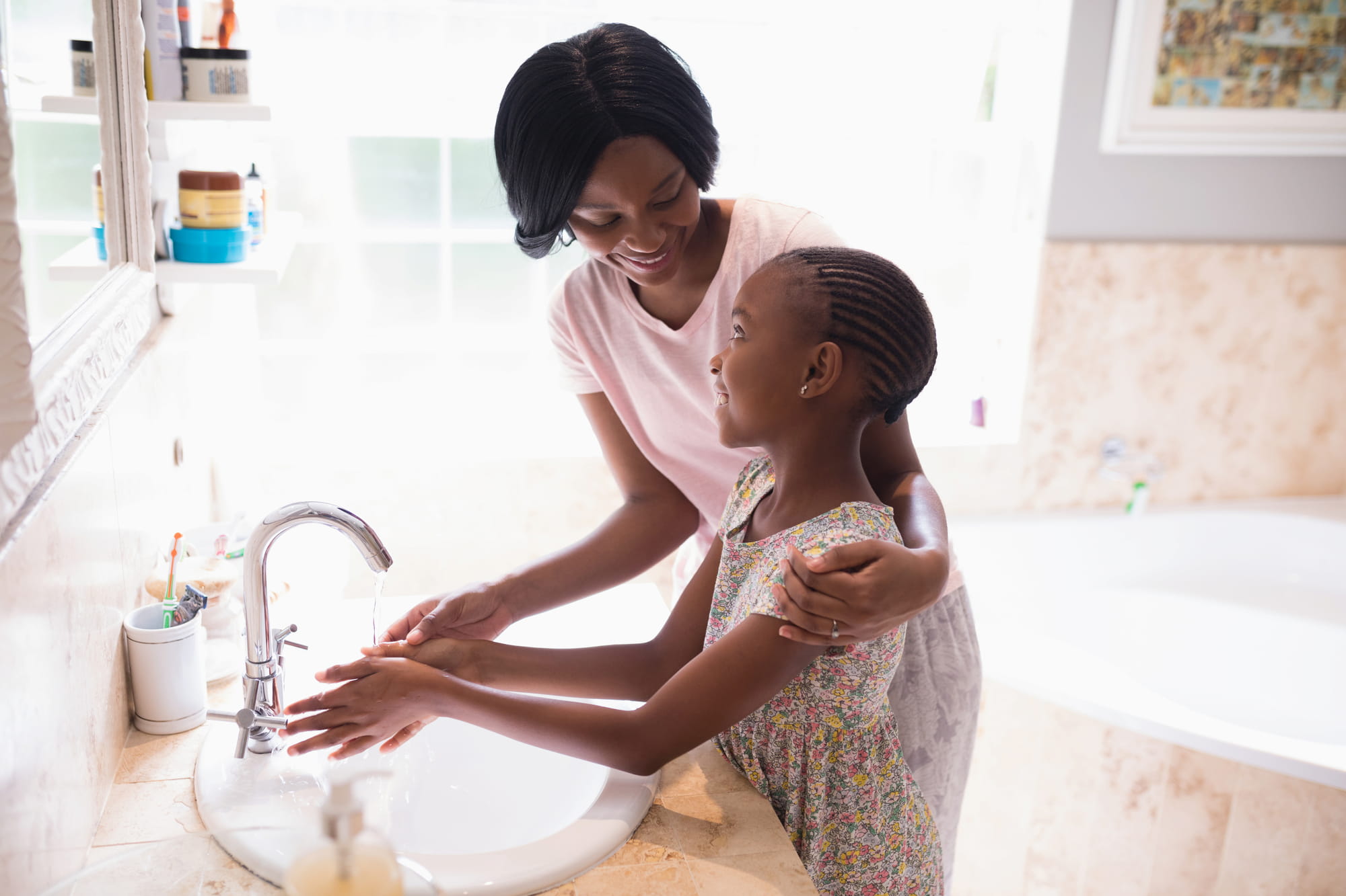 RBT washing a girls hands during an ABA Therapy session