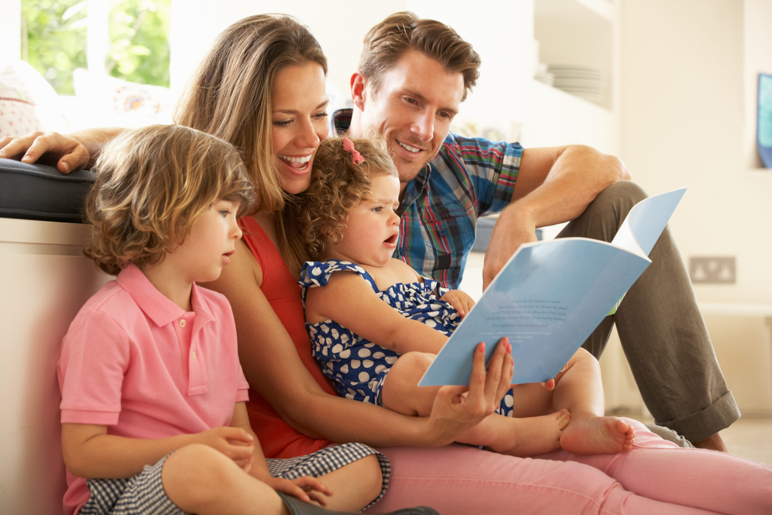 Empowering Parents of Children with Autism, Parents of children with Autism (ASD) Sitting With Children Reading Story