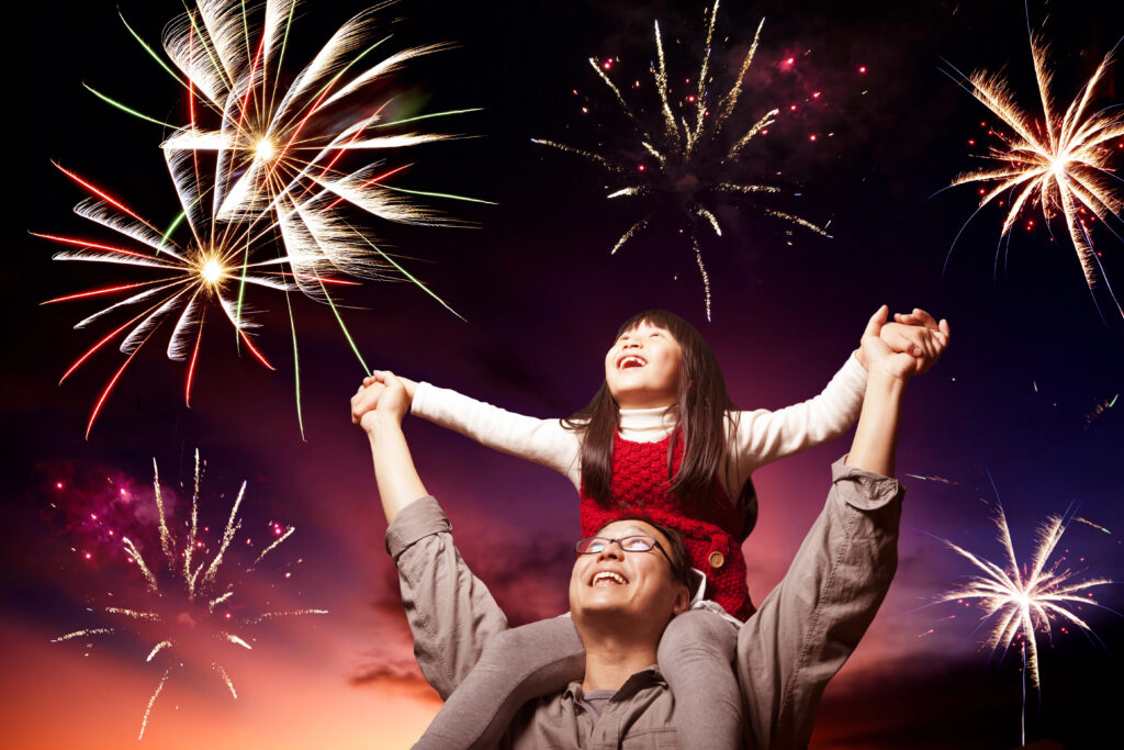 Autistic child enjoying fireworks with family. autism and fireworks