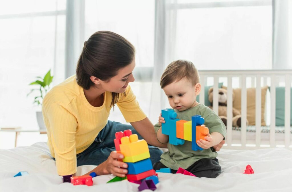 An ABA therapist from Kids Club ABA working one-on-one with a child in Alpharetta, GA, fostering developmental progress through personalized therapy.