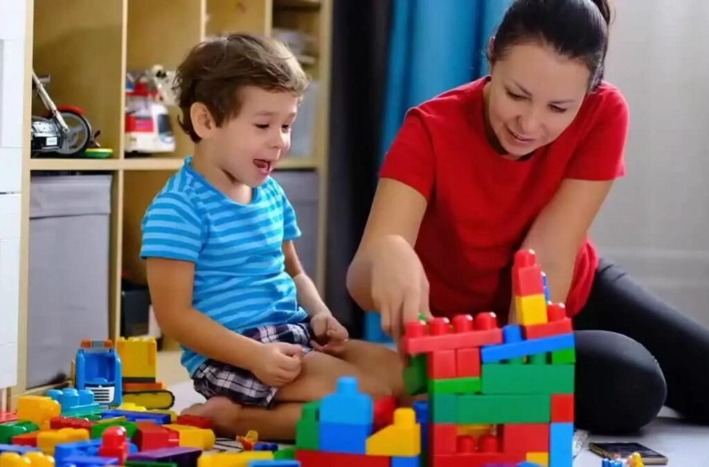 An ABA therapist from Kids Club ABA working with a child in College Park, GA, delivering personalized therapy to support their growth.