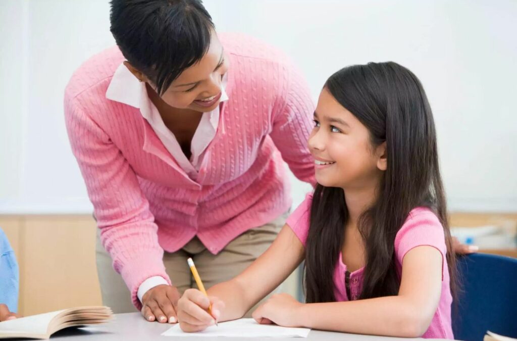 An ABA therapist from Kids Club ABA providing one-on-one therapy to a child in College Park, GA. ABA Therapy Near Me.