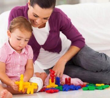 Illustration of a therapist engaging with a child during an ABA therapy session, highlighting the debunking of common misconceptions about ABA therapy in Atlanta.